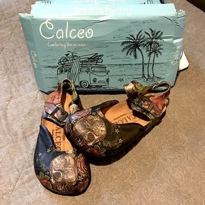 Calceo brand new never worn. Limited edition skull and roses.